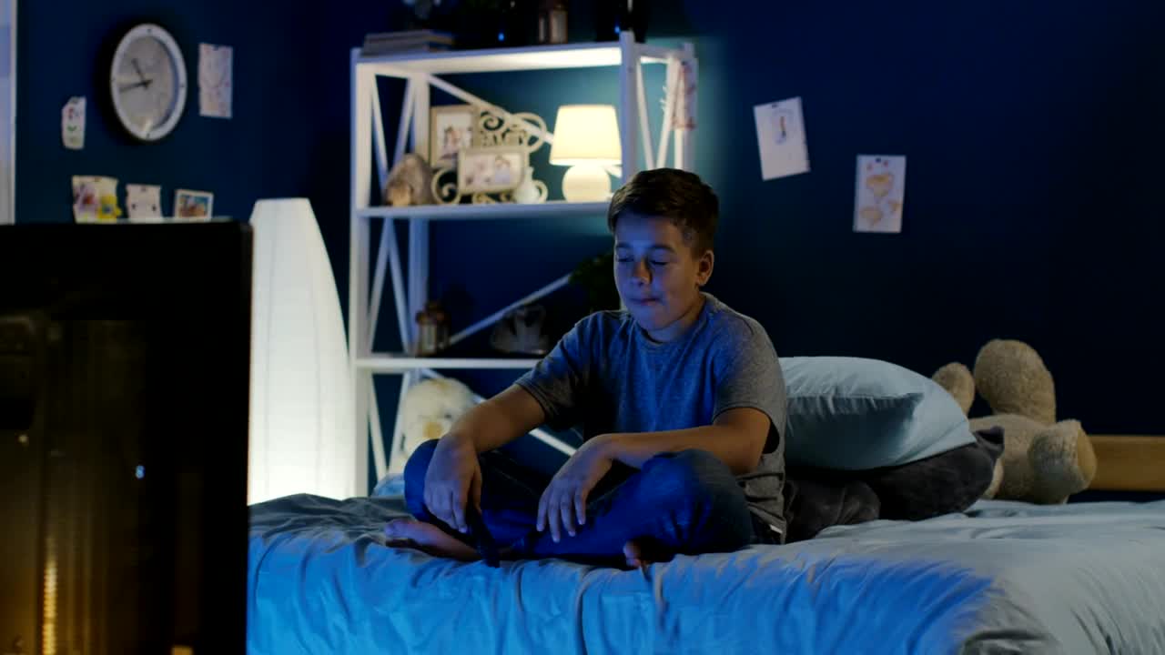 Stock Video Boy Watching A Funny Show On The Tv Late At Live Wallpaper For PC