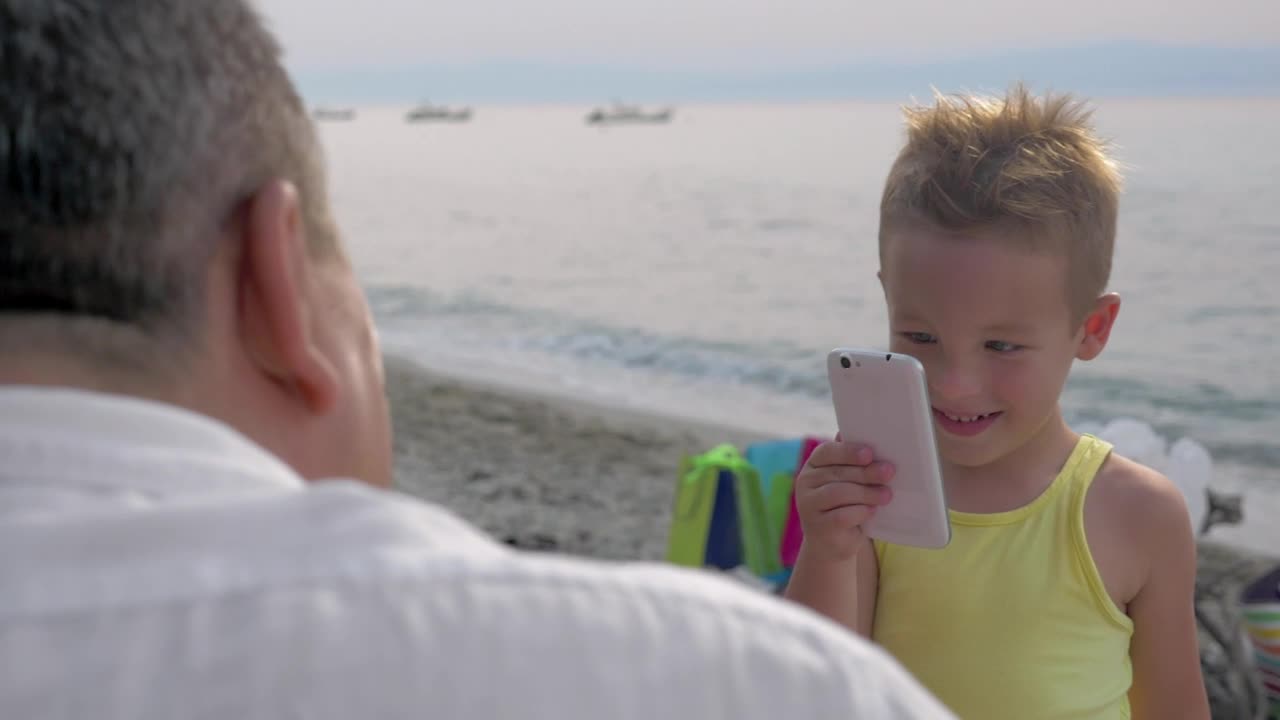 Stock Video Boy Taking A Photo On A Phone Live Wallpaper For PC