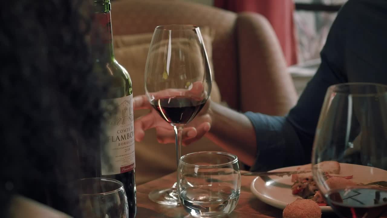 Stock Video Boy Takes His Glass Of Wine During A Dinner With Live Wallpaper For PC