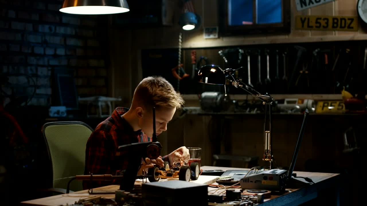 Stock Video Boy Repairing An Rc Car In The Garage Live Wallpaper For PC