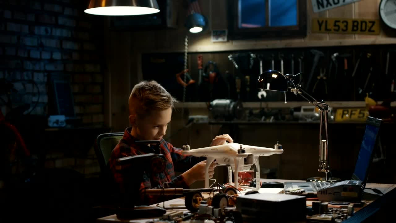 Stock Video Boy Repairing A Drone In The Garage Live Wallpaper For PC
