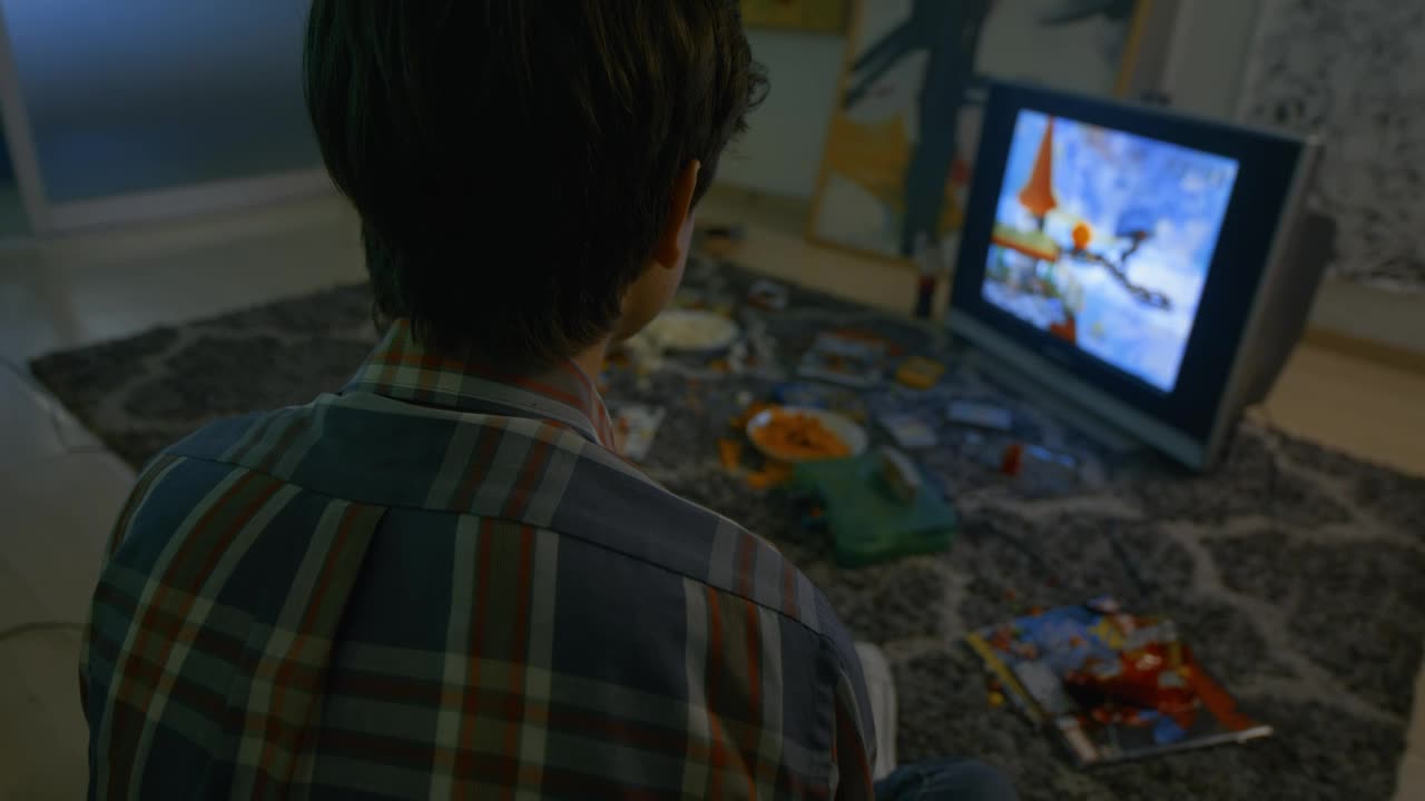 Stock Video Boy Playing Video Games With Chips And Candies Live Wallpaper For PC