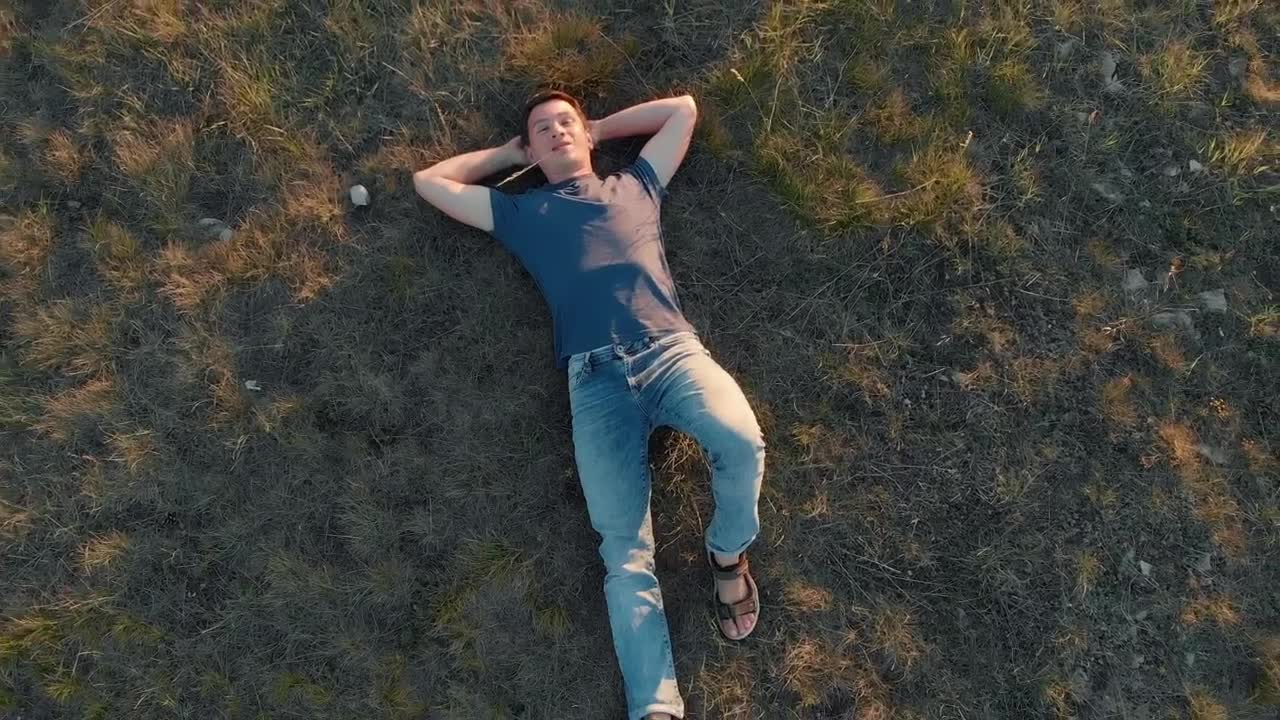 Stock Video Boy Lying Outdoors Top Zoom Out Aerial Shot Live Wallpaper For PC
