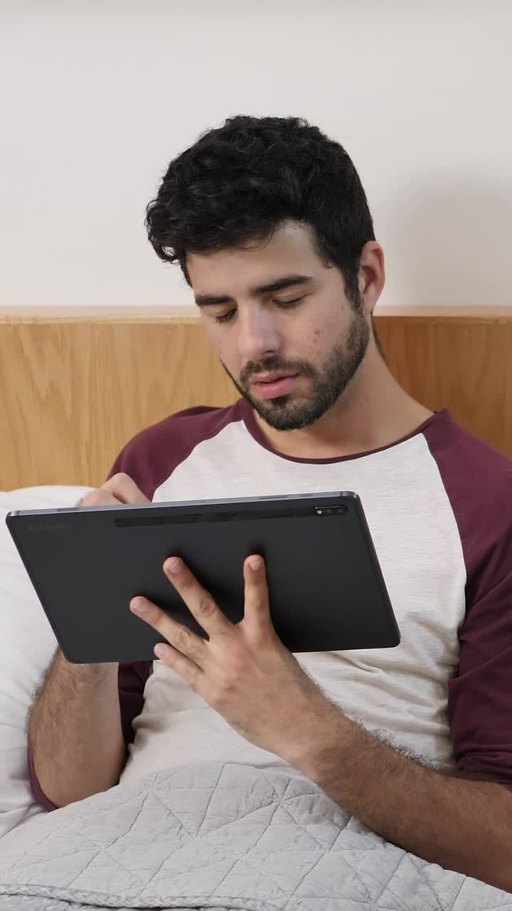 Stock Video Boy Lying Concentrated With A Tablet Before Sleeping Live Wallpaper For PC