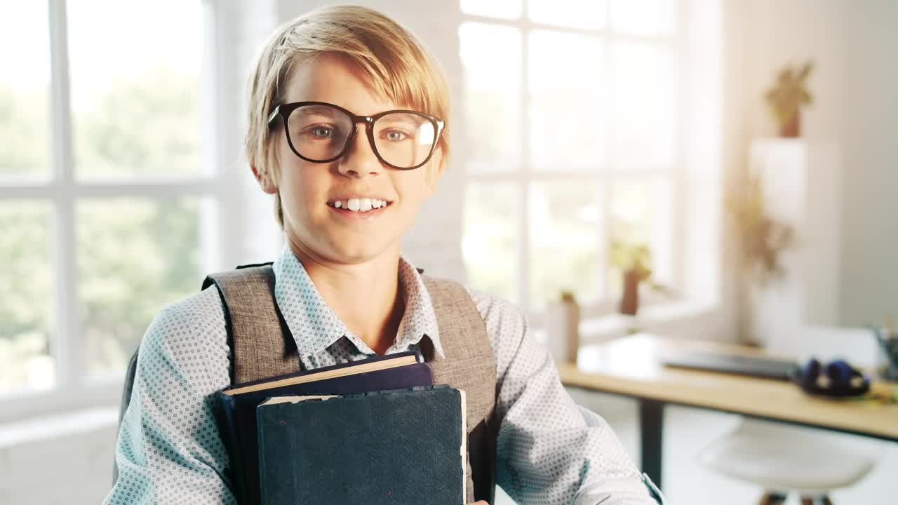 Stock Video Boy In Glasses Smiles And Holds Books In Classroom Live Wallpaper For PC