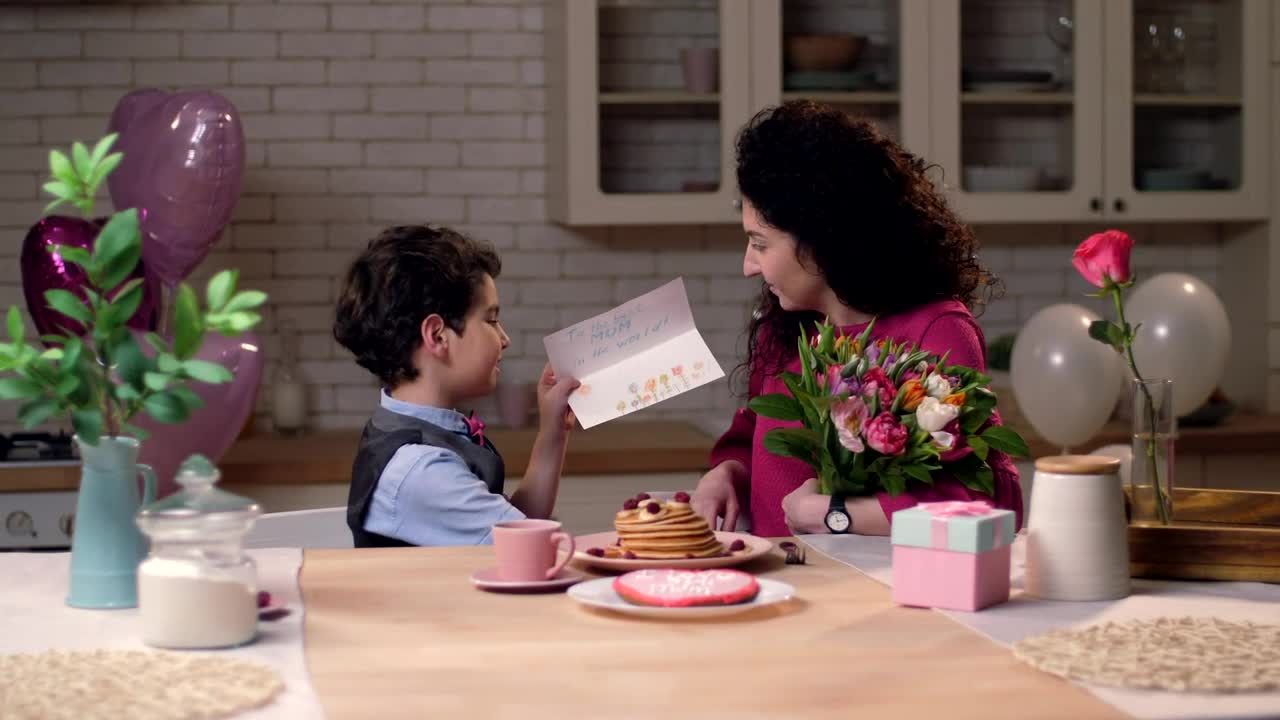 Stock Video Boy Giving His Mother A Card Live Wallpaper For PC