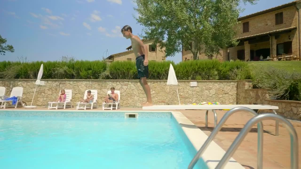 Stock Video Boy Entering The Pool Side Tracking Shot Live Wallpaper For PC