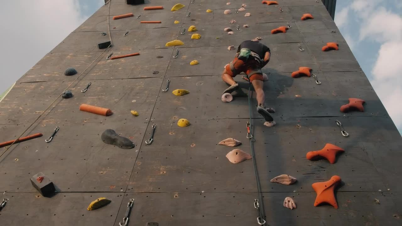 Stock Video Boy Climbing To The Top Of A Mountaineering Wall Live Wallpaper For PC