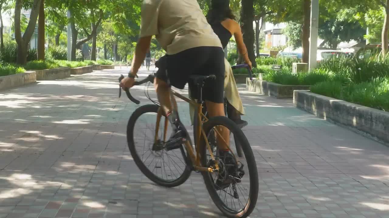 Stock Video Boy And Girl Zigzagging During A Bike Ride Live Wallpaper For PC