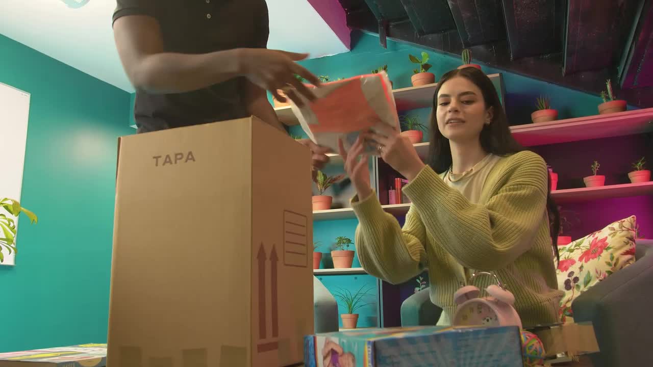 Stock Video Boy And Girl Packing Things In A Box Live Wallpaper For PC