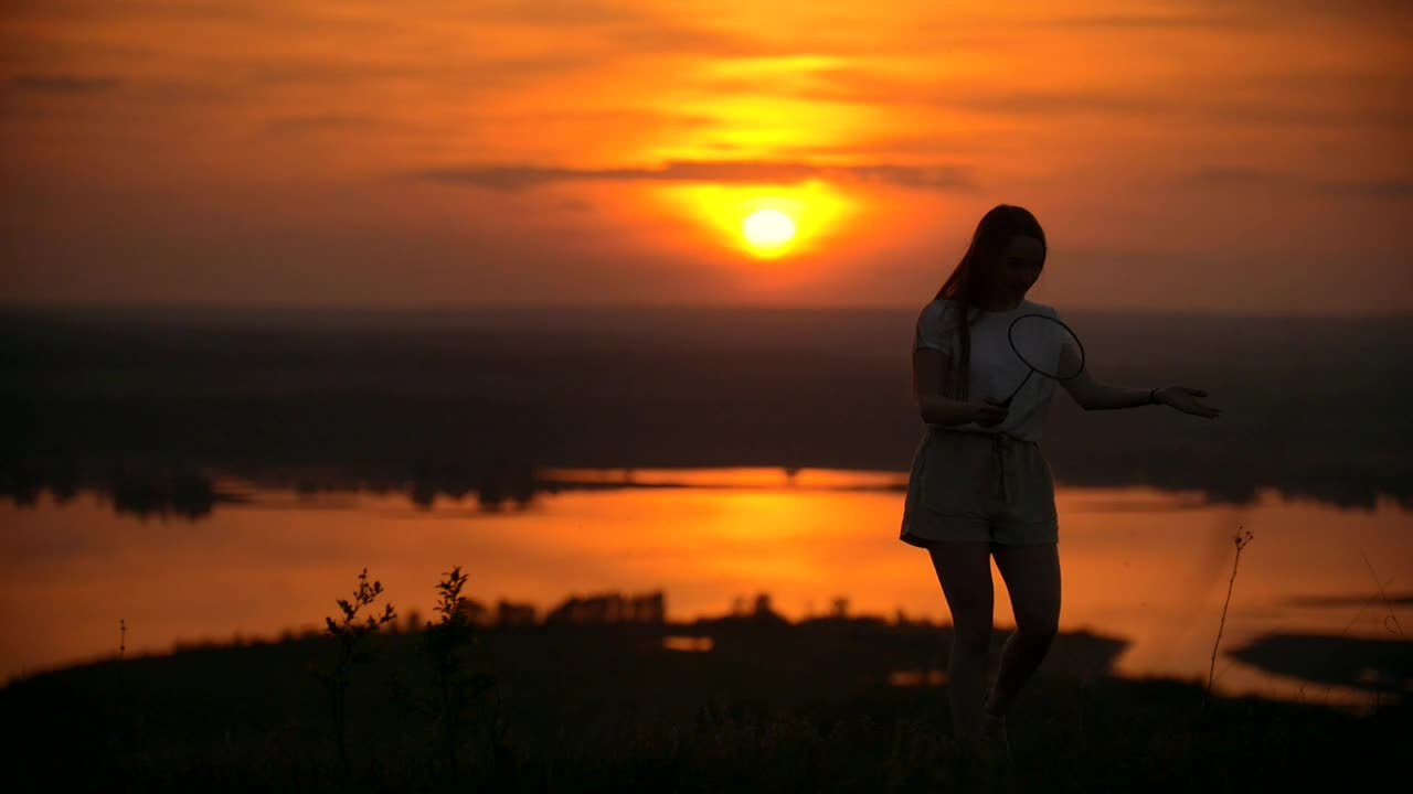 Stock Video Boy And Girl Playing Badminton In The Sunset Live Wallpaper For PC