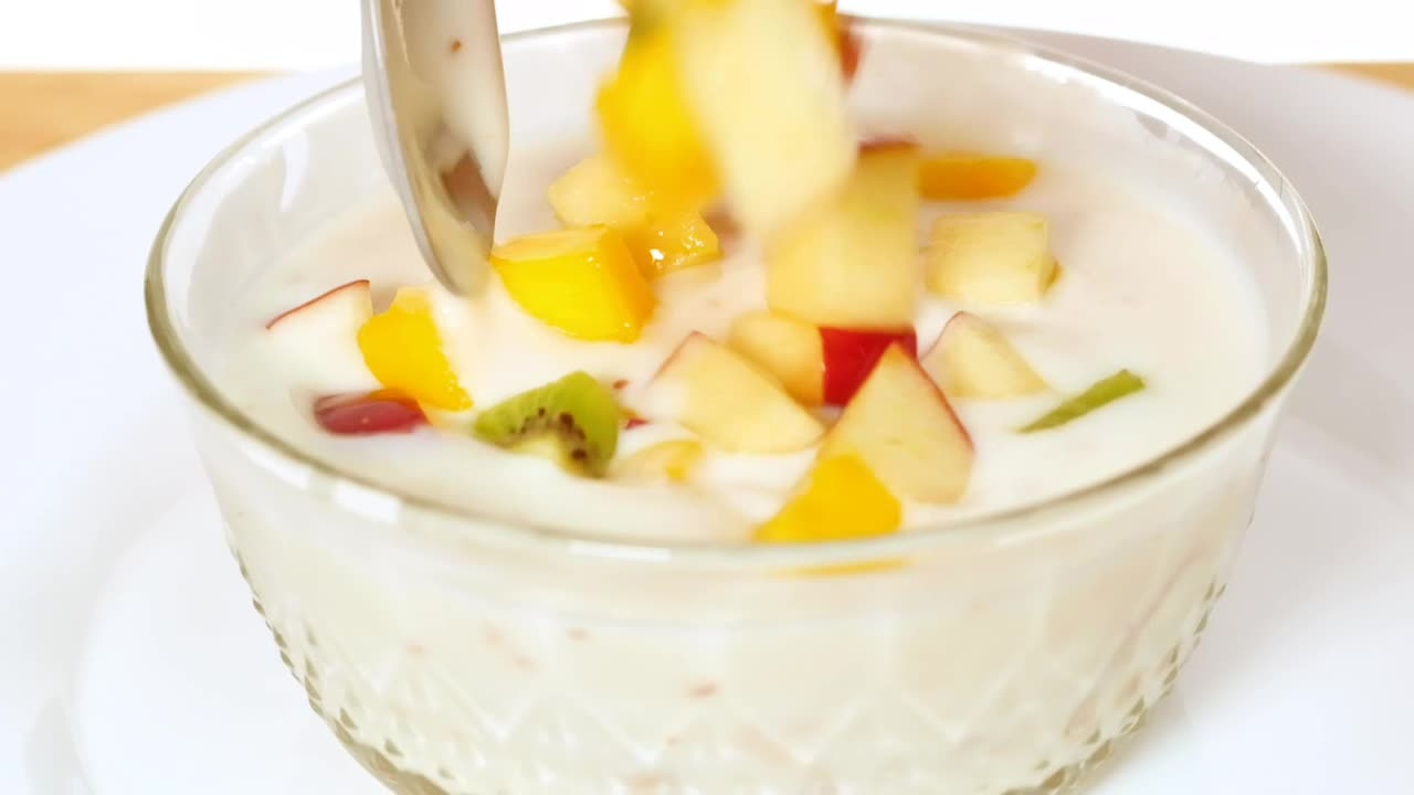 Stock Video Bowl With Yogurt Served With Chopped Fruit Live Wallpaper For PC