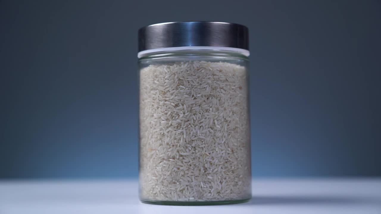Stock Video Bowl Full Of Rice On A Table With Blue Background Live Wallpaper For PC