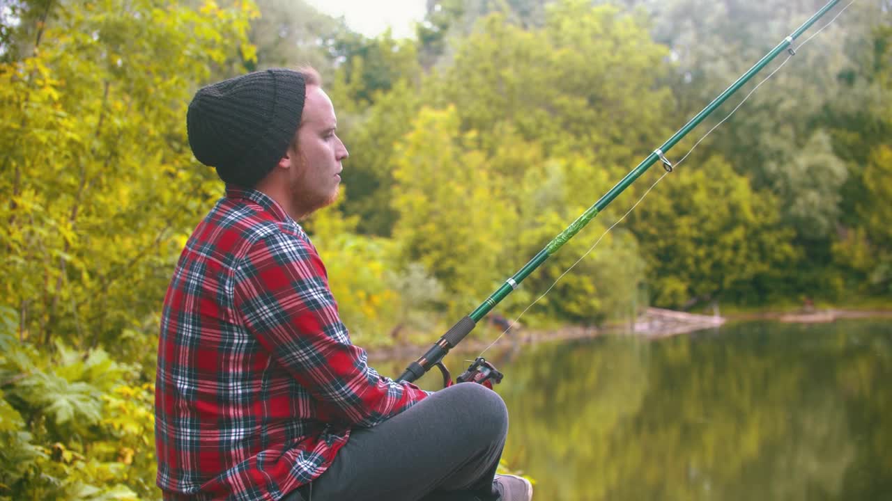 Stock Video Bored Young Man Fishing In The Forest Live Wallpaper For PC
