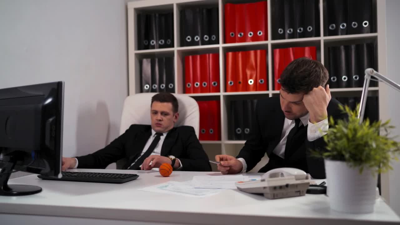 Stock Video Bored Young Office Workers In An Office Live Wallpaper For PC