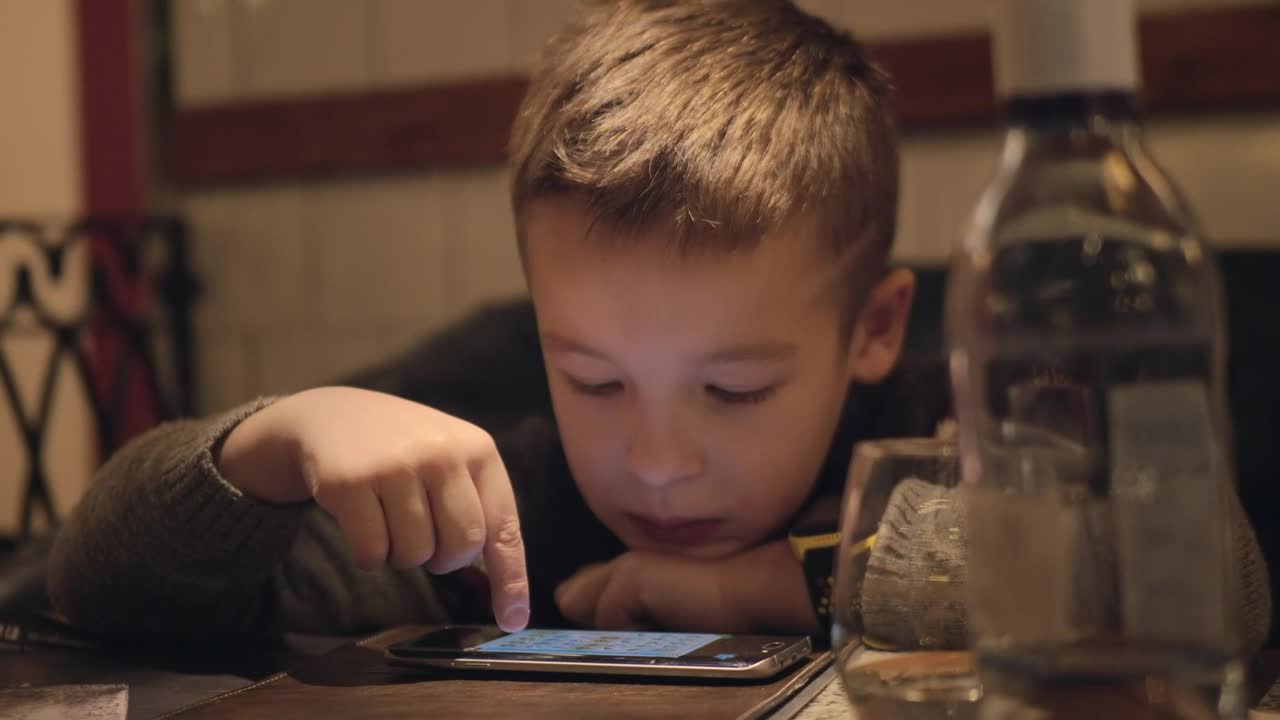 Stock Video Bored Boy Using A Phone In A Cafe Live Wallpaper For PC