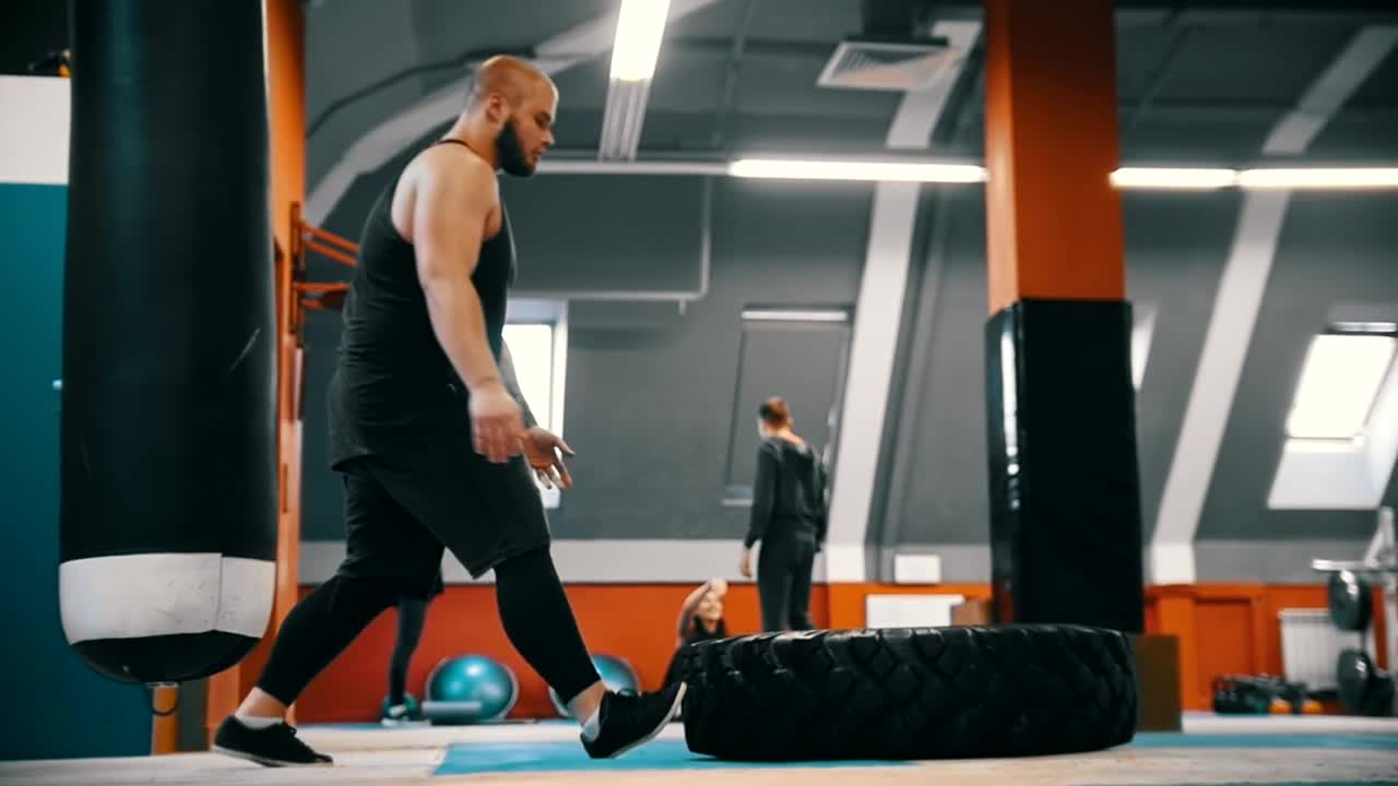 Stock Video Bodybuilder Flips A Tire On The Gym Floor Live Wallpaper For PC