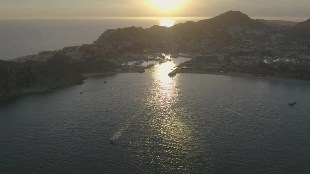 Stock Video Boats And Motorboats Sailing Along A Coastline During Sunset Live Wallpaper For PC