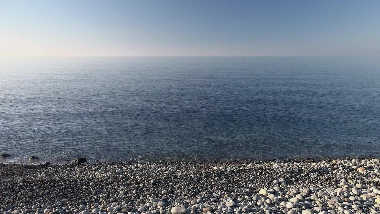 Stock Video Boat Sailing In A Calm Sea Near The Rocky Beach Live Wallpaper For PC