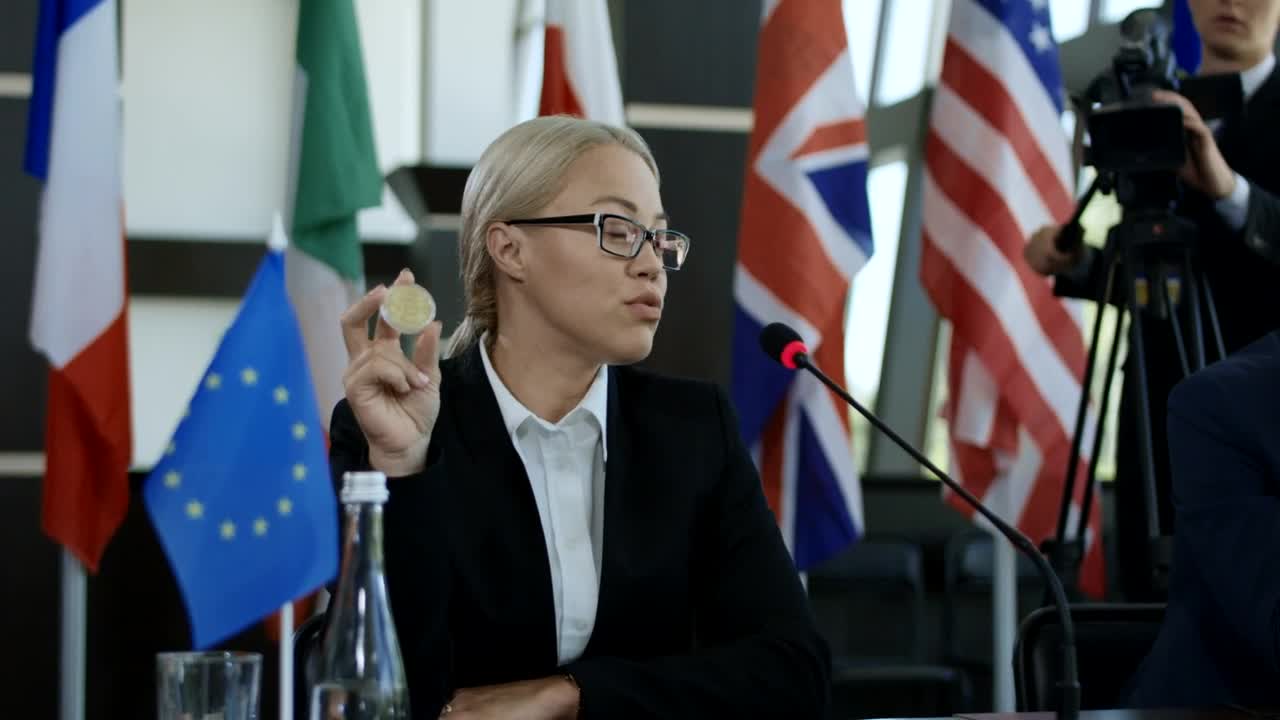 Stock Video Blonde Woman Talking About Bitcoin In A Conference Live Wallpaper For PC