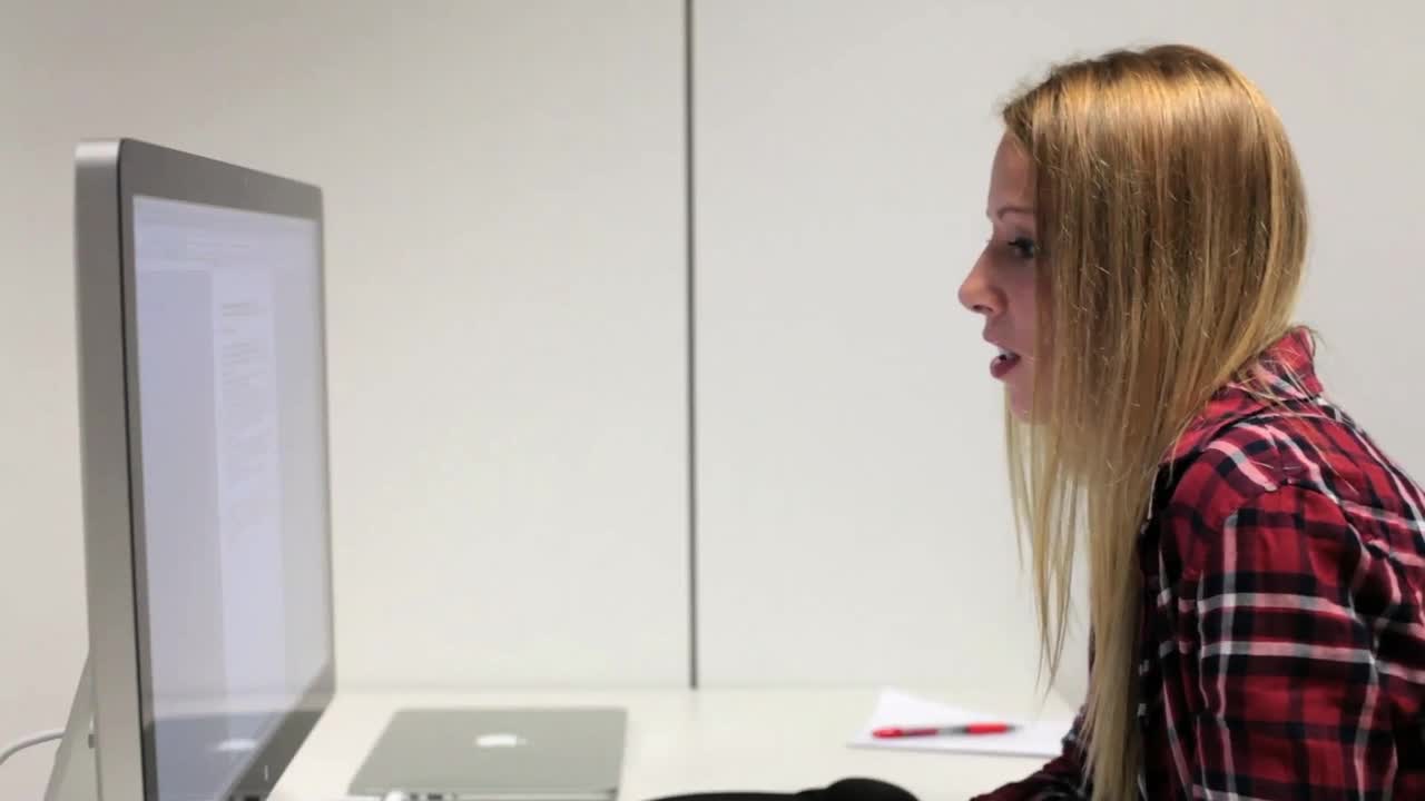 Stock Video Blonde Woman In Front Of A Computer Live Wallpaper For PC