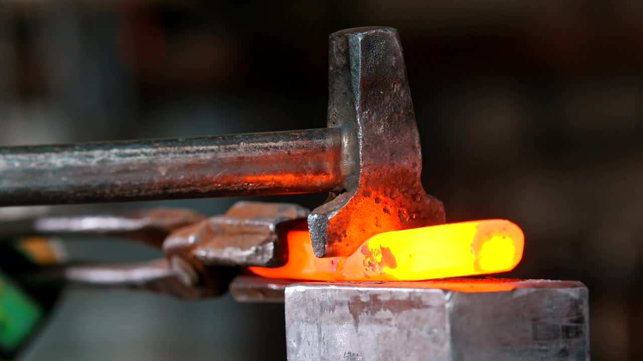 Stock Video Blacksmith Working On A Piece Incandescent Metal Live Wallpaper For PC