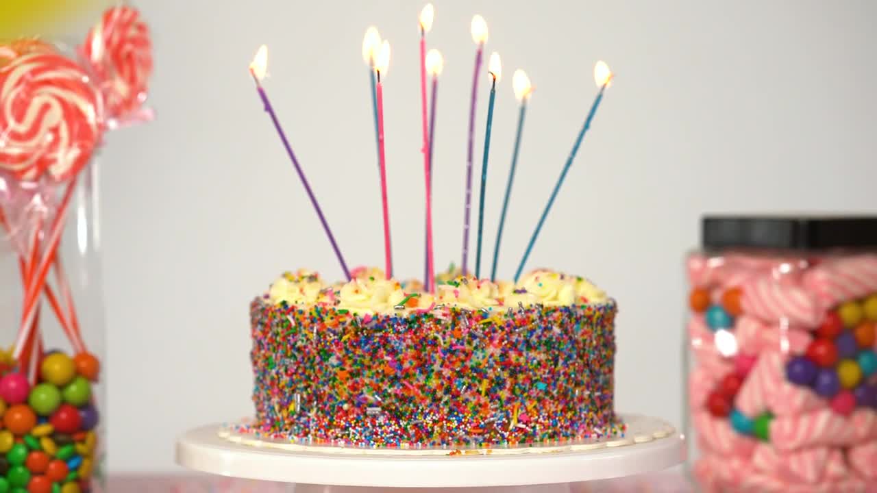 Stock Video Birthday Cake On A Table With Candies On A White Live Wallpaper For PC
