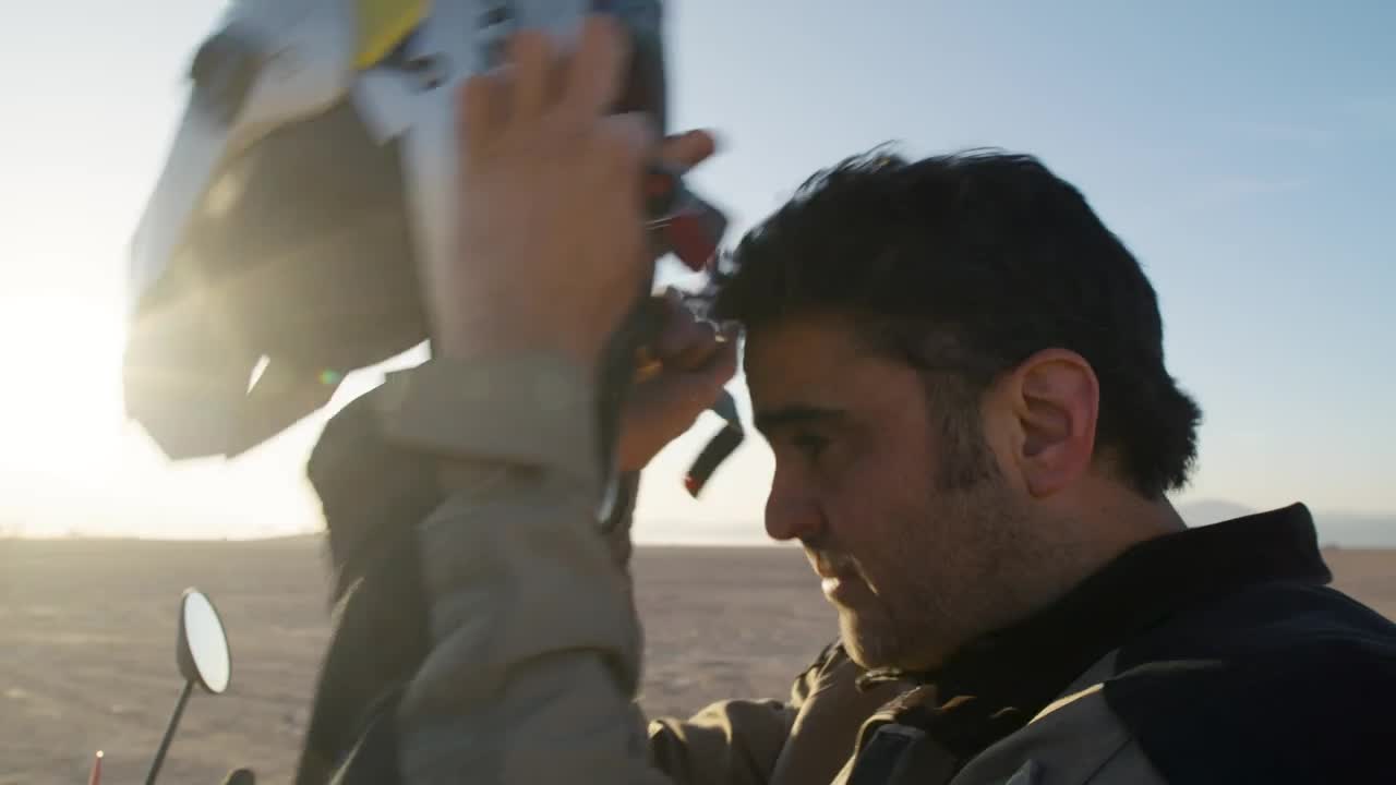 Stock Video Biker Putting On His Helmet Live Wallpaper For PC