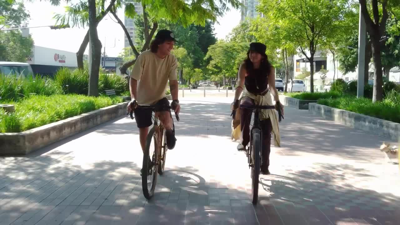 Stock Video Bike Ride Of A Couple Through A City Park Live Wallpaper For PC