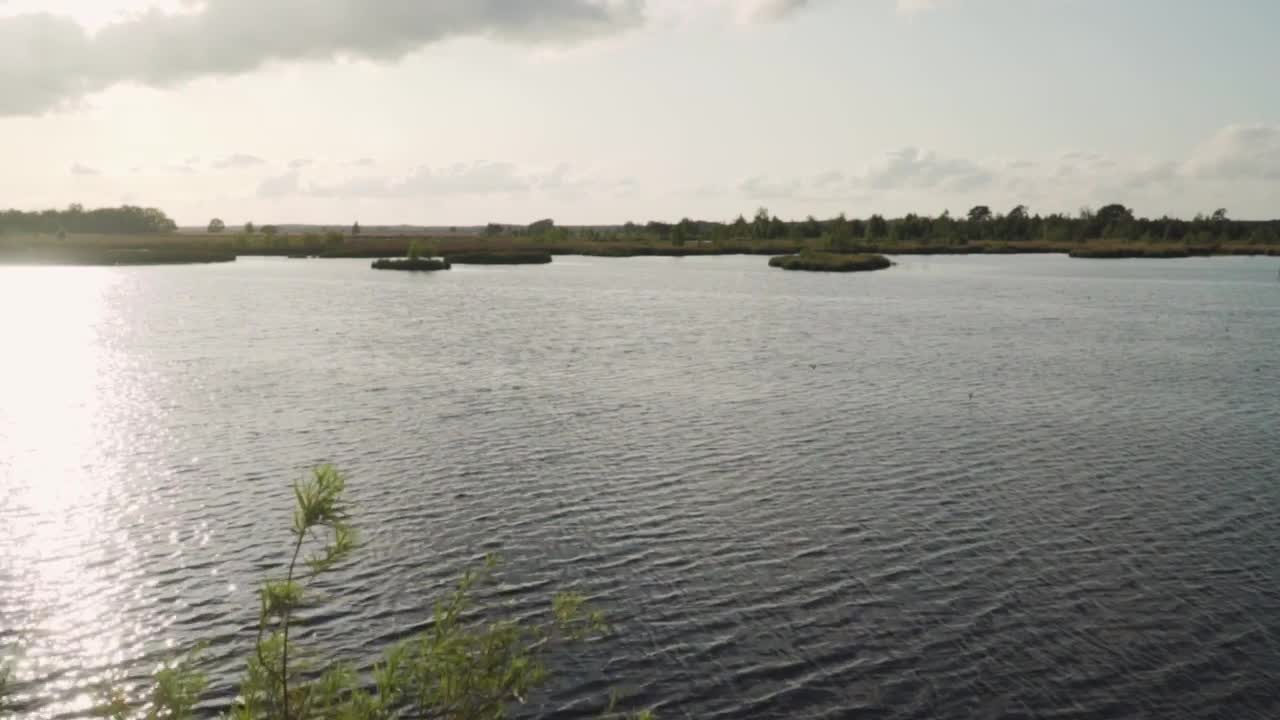 Stock Video Big Lake Reflecting Sunlight Live Wallpaper For PC