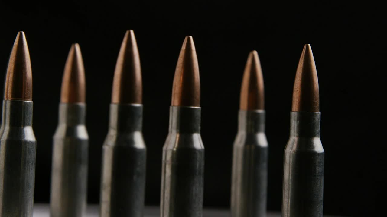 Stock Video Big Bullets Rotating On A Black Background Live Wallpaper For PC
