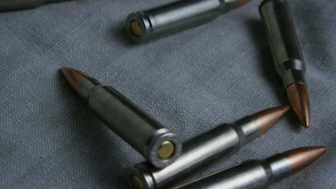 Stock Video Big Bullets Over A Fabric Live Wallpaper For PC