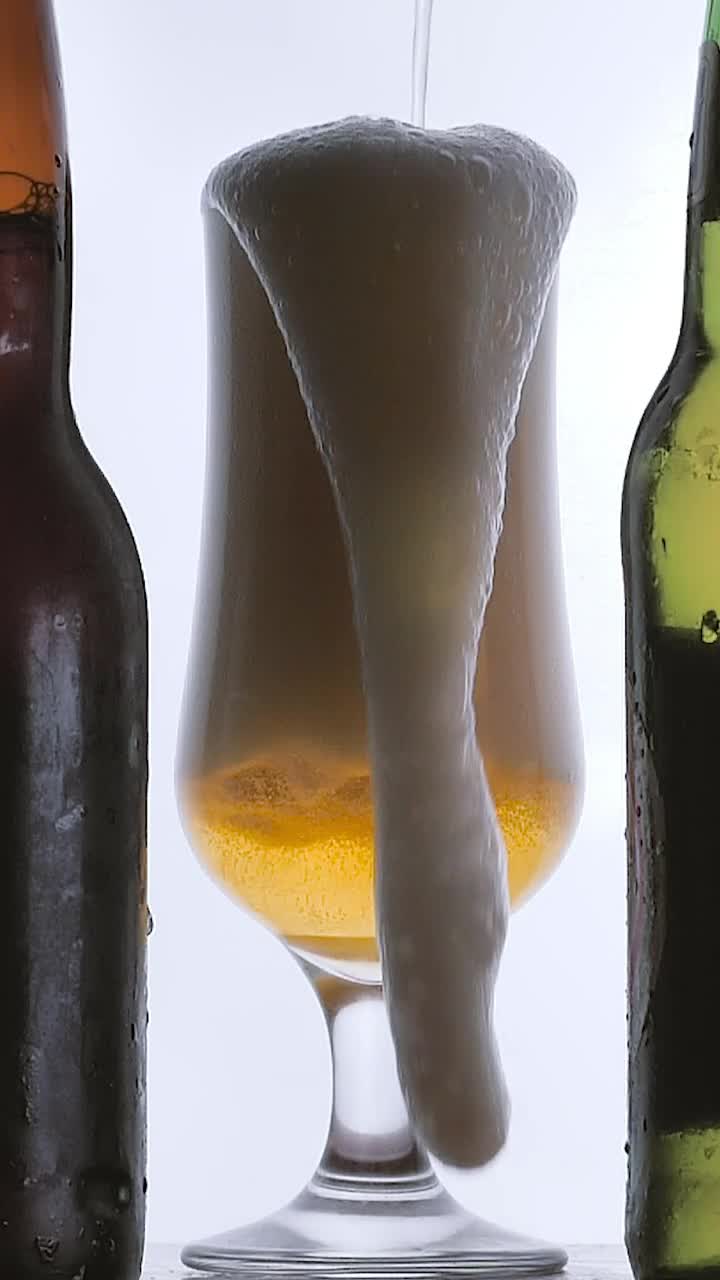 Stock Video Beer Foam Spilling Into A Glass On White Background Live Wallpaper For PC