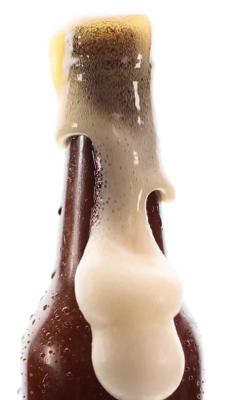 Stock Video Beer Bottle Spilling Foam On A White Background Live Wallpaper For PC