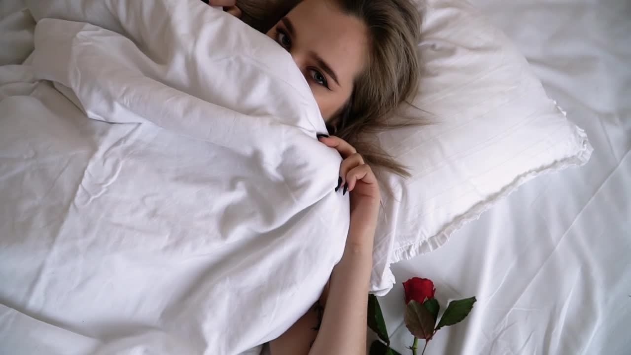 Stock Video Beautiful Woman In Bed Covers Face And Winks Live Wallpaper For PC