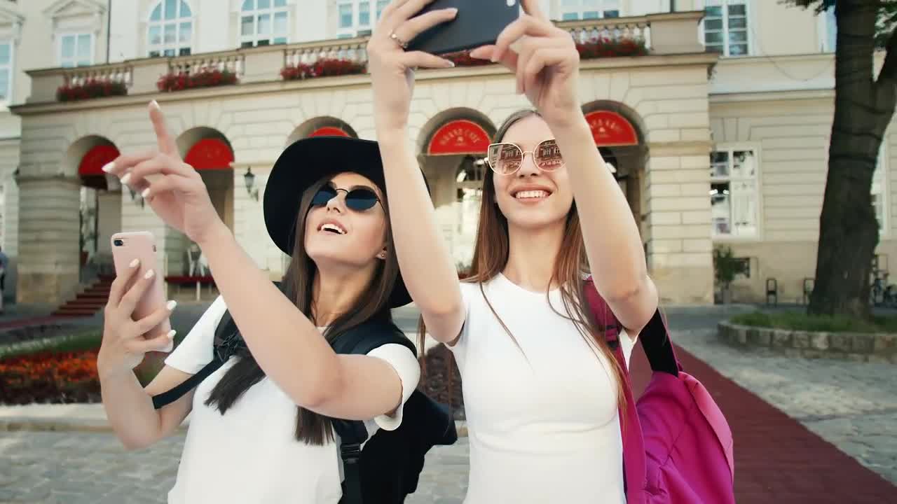 Stock Video Beautiful Tourists Pose For Social Media In European Town Live Wallpaper For PC