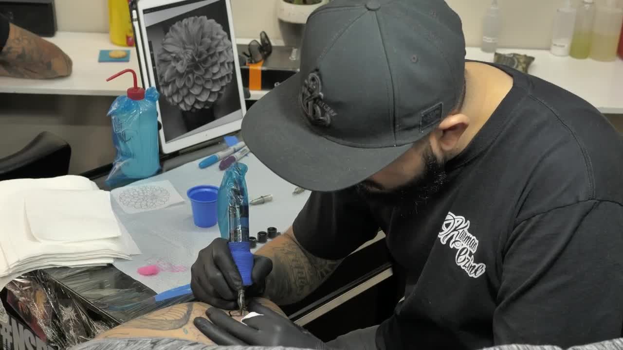 Stock Video Bearded Tattooist Making A Flower Live Wallpaper For PC