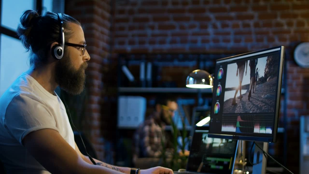 Stock Video Bearded Man Working On Video Editing Live Wallpaper For PC
