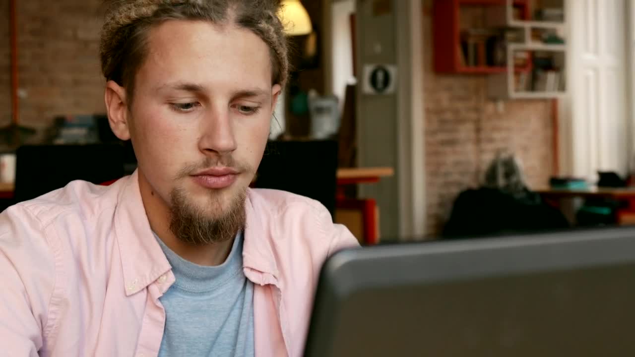 Stock Video Bearded Man Working On His Laptop From Home Live Wallpaper For PC