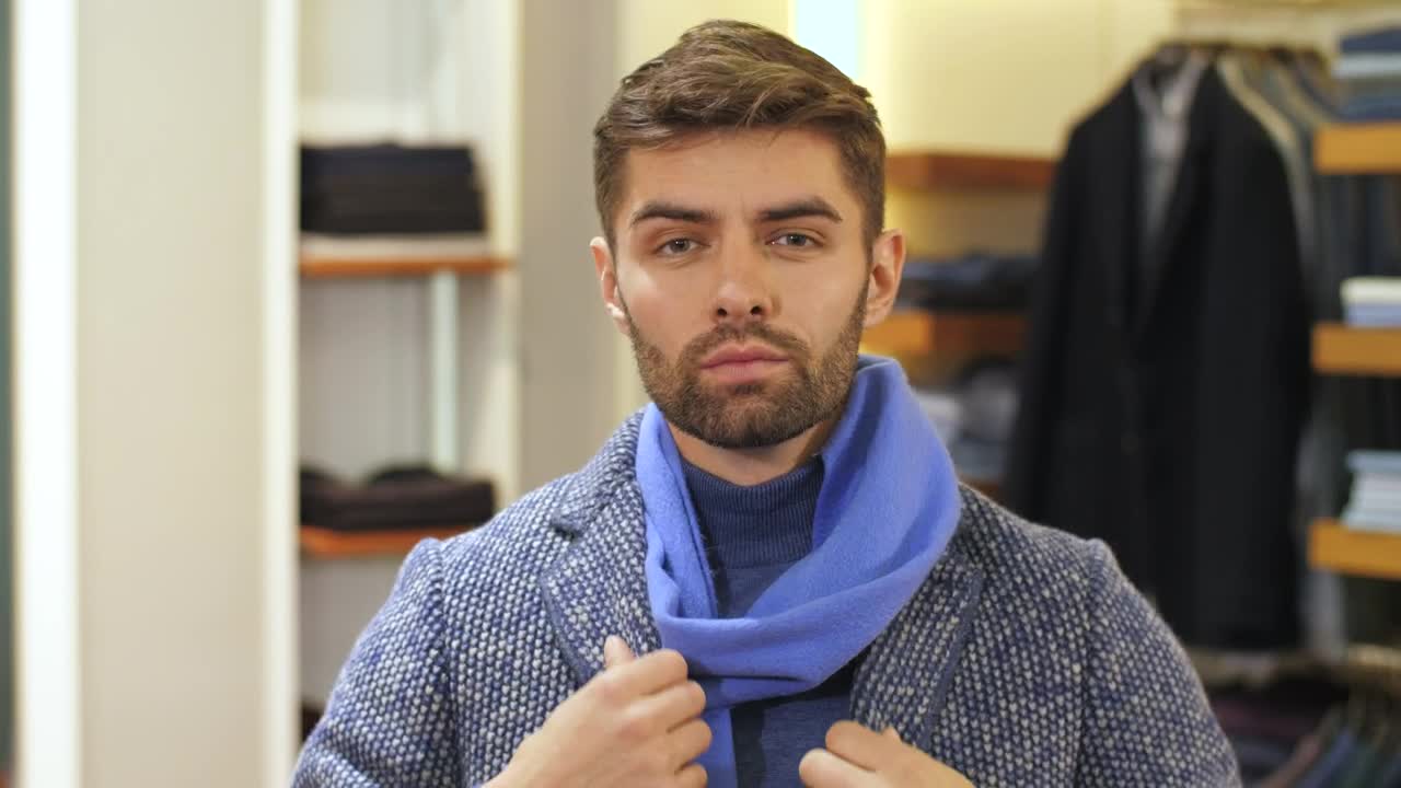 Stock Video Bearded Man Tries On Clothes In The Store Live Wallpaper For PC