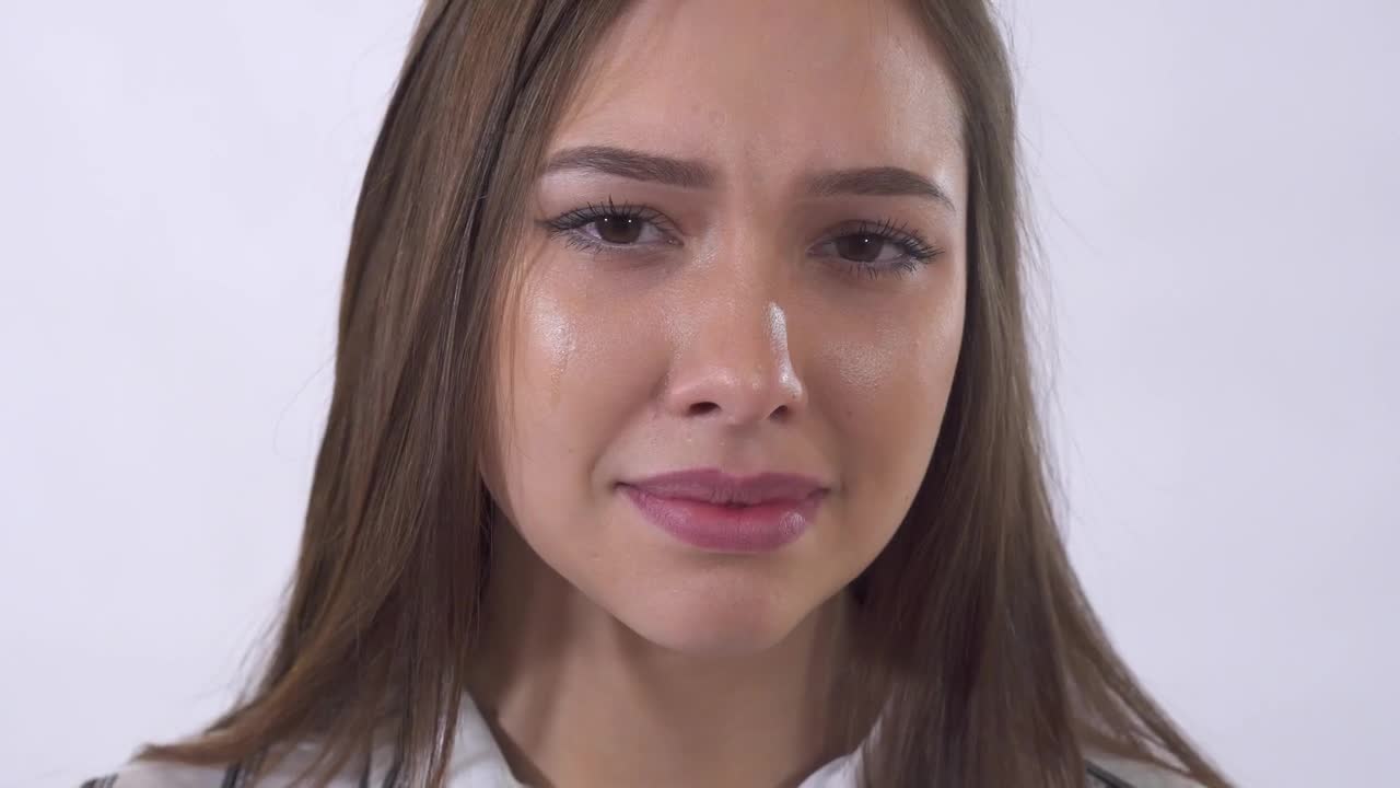 Video Stock Closeup Of Young Woman Crying On White Background Live Wallpaper For PC