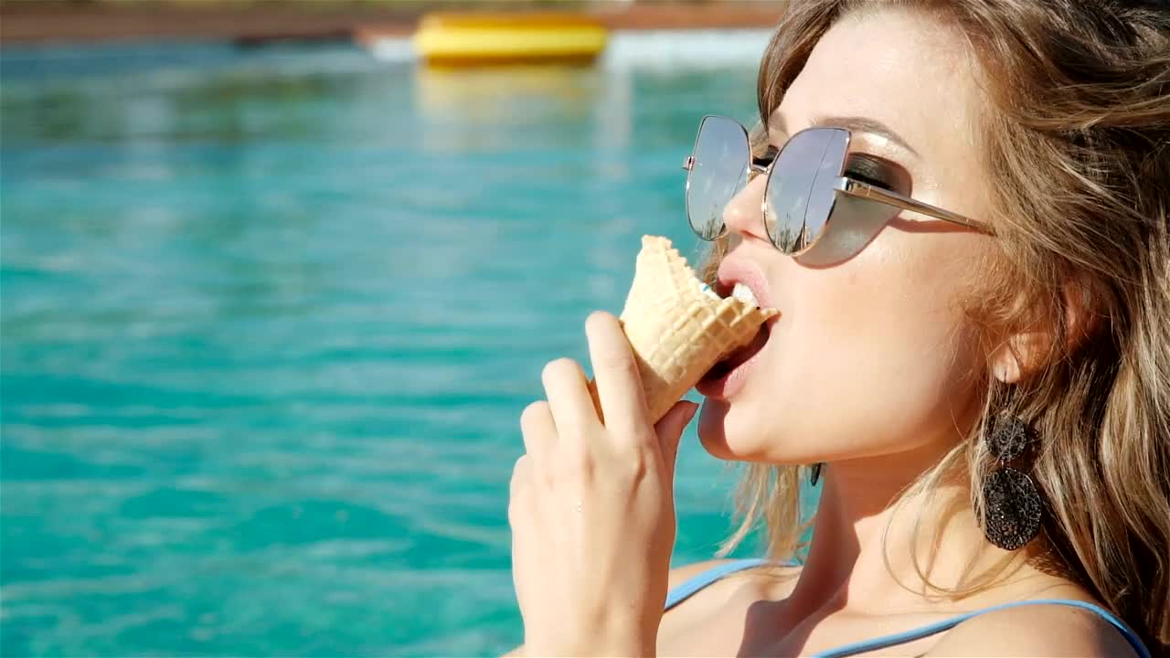 Video Stock Closeup Of Woman Eating Ice Cream In Swimsuit Live Wallpaper For PC