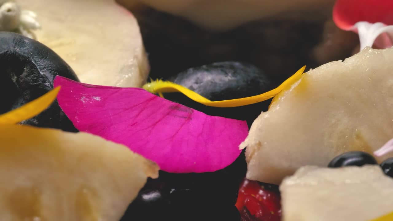 Video Stock Close Up Of Natural Fruit Pieces Decorated With Petals Live Wallpaper For PC