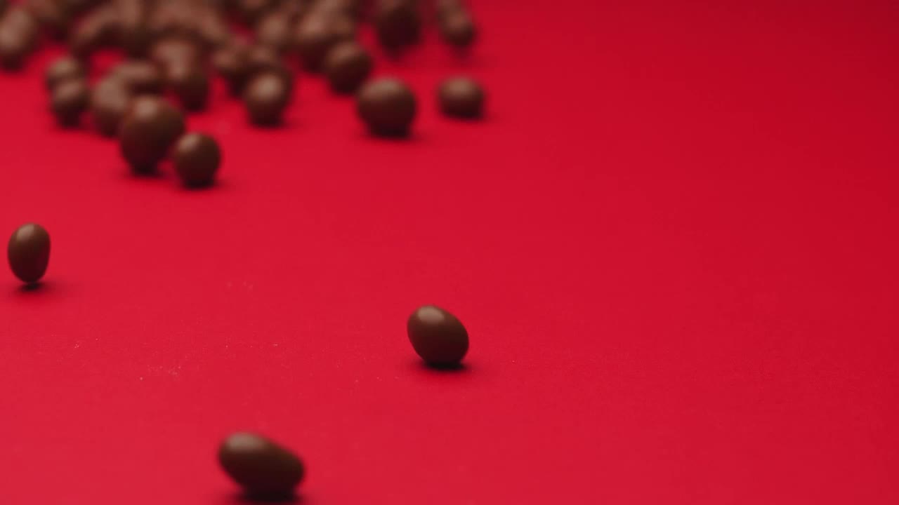 Video Stock Chocolate Beans Rolling On A Red Surface Live Wallpaper For PC