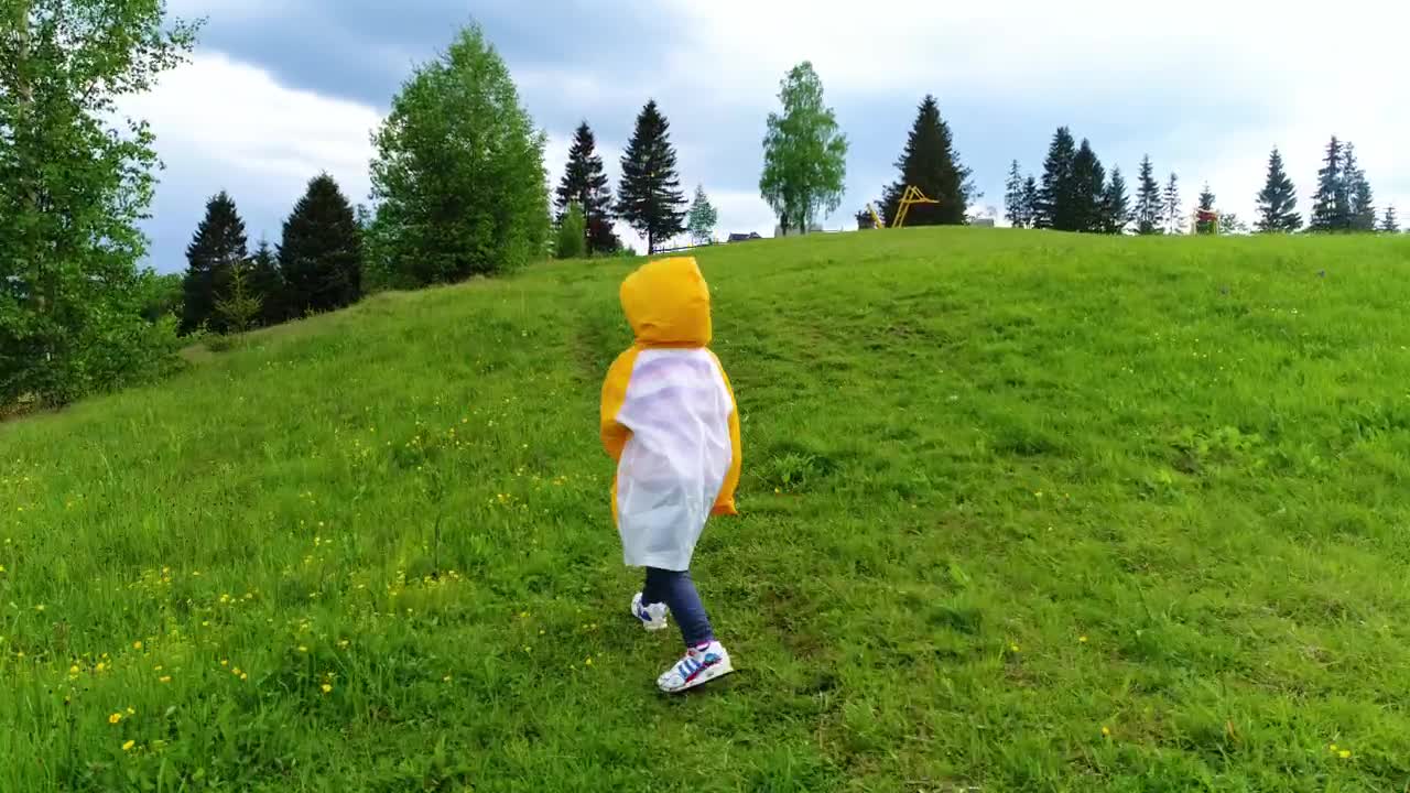 Video Stock Child Taking A Walk In The Grass Wearing A Raincoat Live Wallpaper For PC