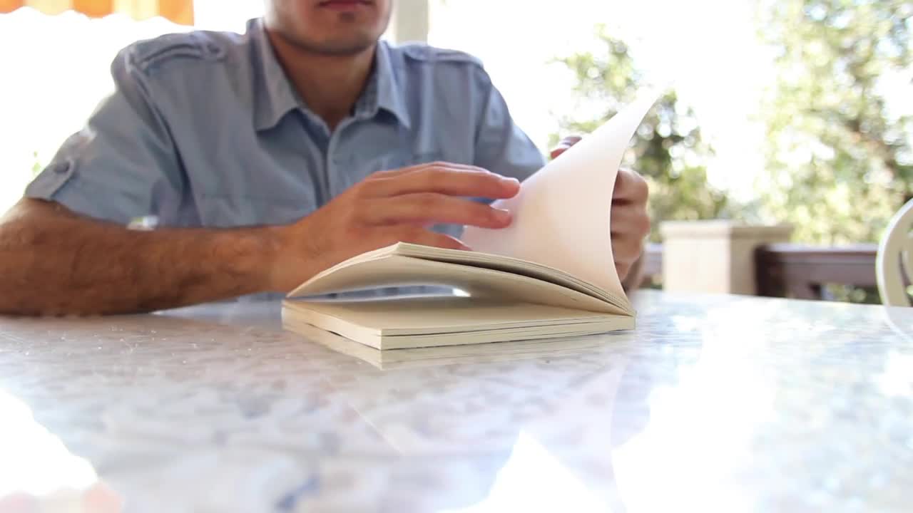 Video Stock Chico Leafing Through A Book To Start Reading Live Wallpaper For PC