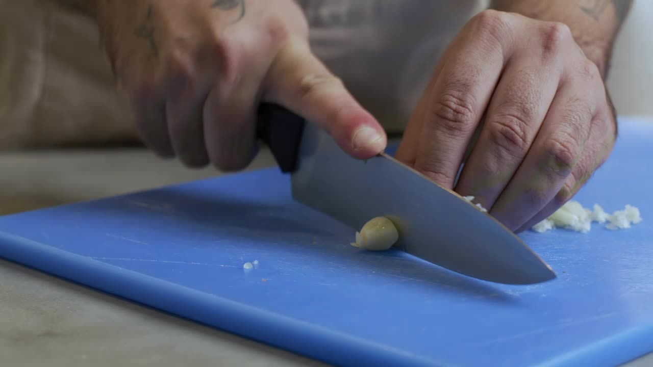 Video Stock Chef Skillfully Chopping Garlic Live Wallpaper For PC