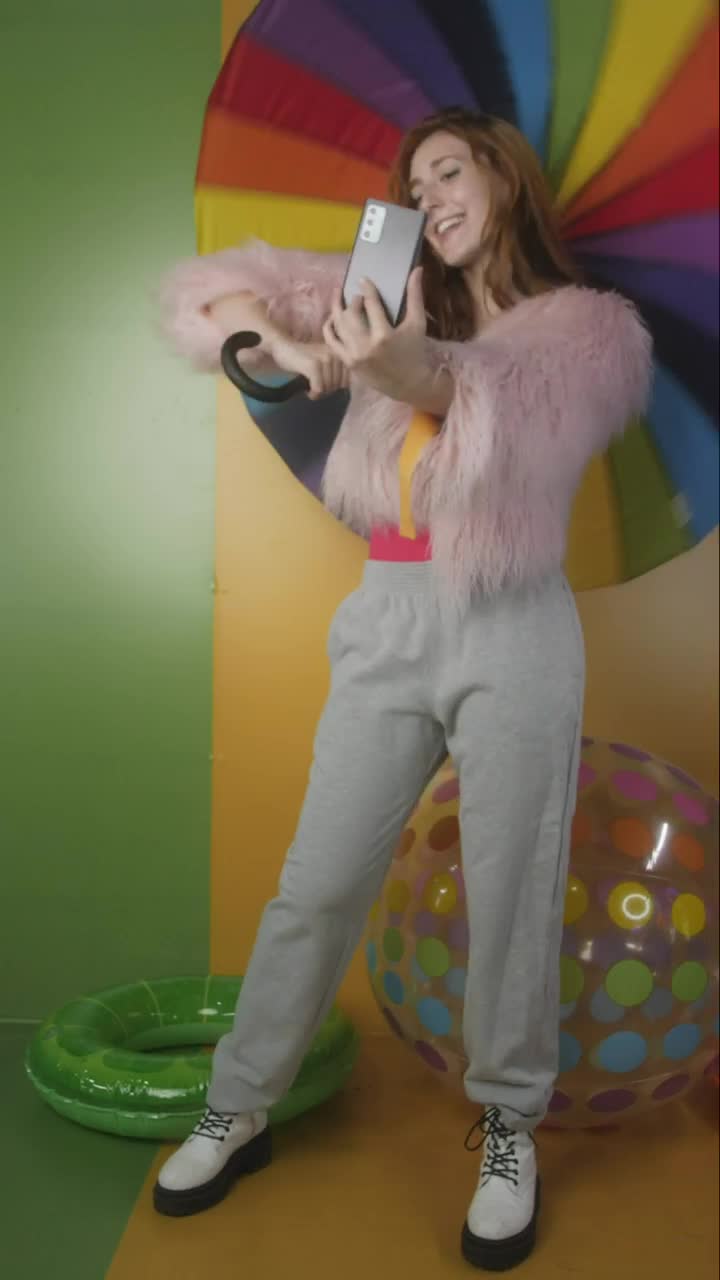 Video Stock Cheerful Girl Recording Herself With A Colorful Background Live Wallpaper For PC