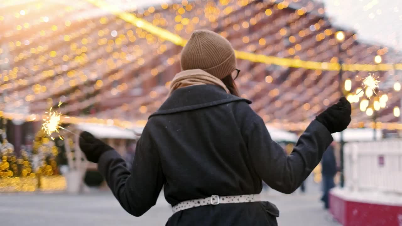Video Stock Cheerful Girl Holding Sparklers On A Cold Day At Christmas Live Wallpaper For PC