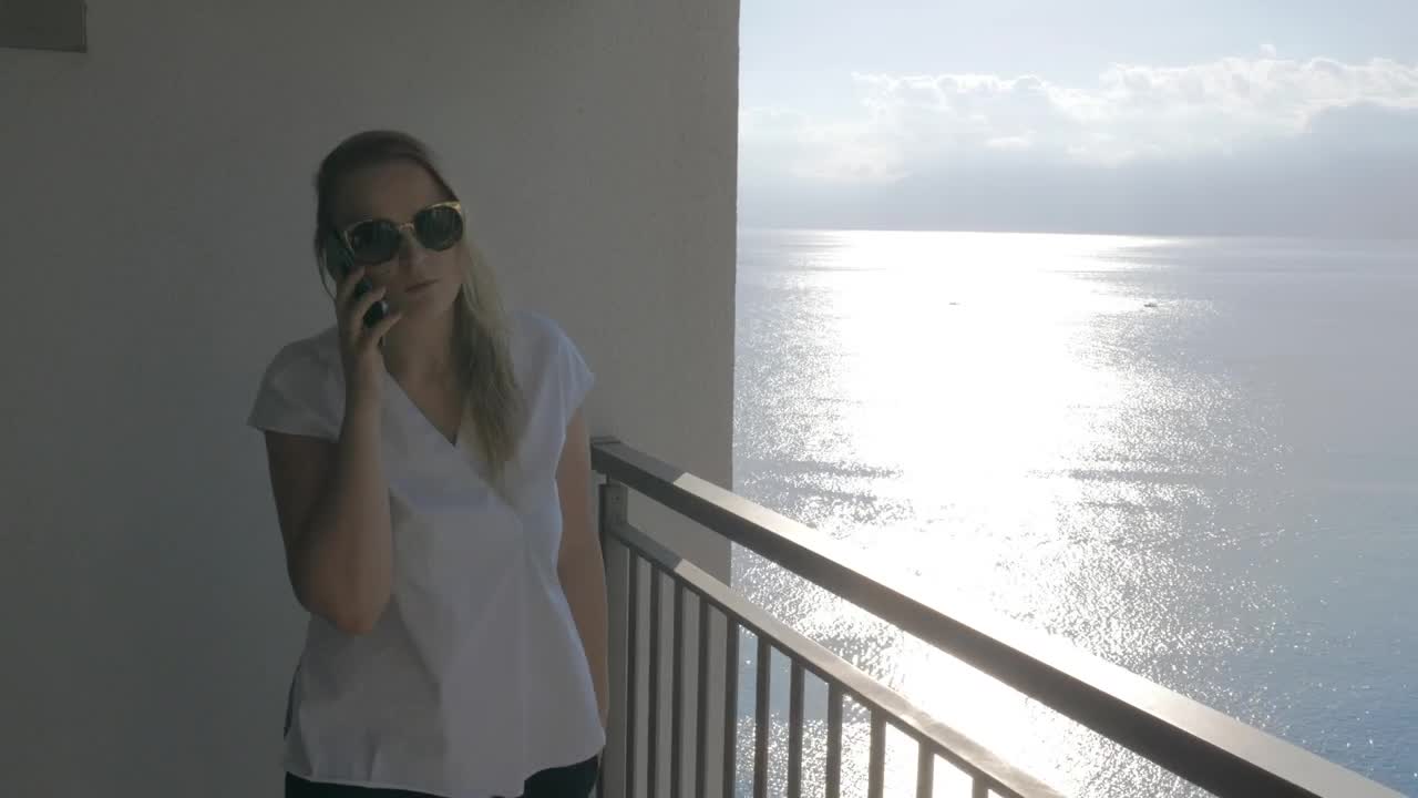 Video Stock Chatting On The Phone While Standing On A Balcony Live Wallpaper For PC